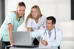 Medical partners working with computer